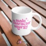 Main Character Energy UVDTF Sticker design on a ceramic mug mockup, ideal for vibrant customized craft gifts.