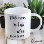 Dis Nou Koffie UVDTF Sticker design on a ceramic mug mockup, ideal for vibrant customized craft gifts.