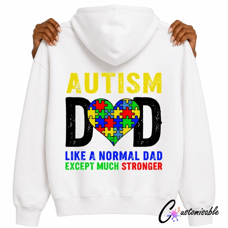 Autism Dad DTF Transfer – Colourful Puzzle Heart Hoodie & T-Shirt Design White hoodie mockup with an Autism Dad DTF transfer design, featuring yellow and black distressed text, a colourful puzzle-piece heart, and the phrase “Like a normal dad except much stronger.”