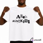 White T-shirt with black “Aweh Masekind” DTF transfer design, shown on a model holding the shirt for a custom apparel mockup.