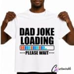 White T-shirt with “Dad Joke Loading Please Wait” DTF transfer design featuring bold black text and a colourful loading bar graphic.