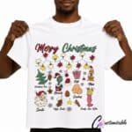 White T-shirt with “Merry Christmas” DTF transfer design featuring festive character icons, stars, Santa, cookies, gifts, stockings, and holiday decorations.