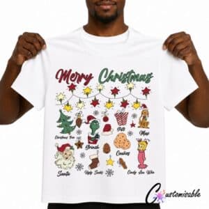 White T-shirt with “Merry Christmas” DTF transfer design featuring festive character icons, stars, Santa, cookies, gifts, stockings, and holiday decorations.