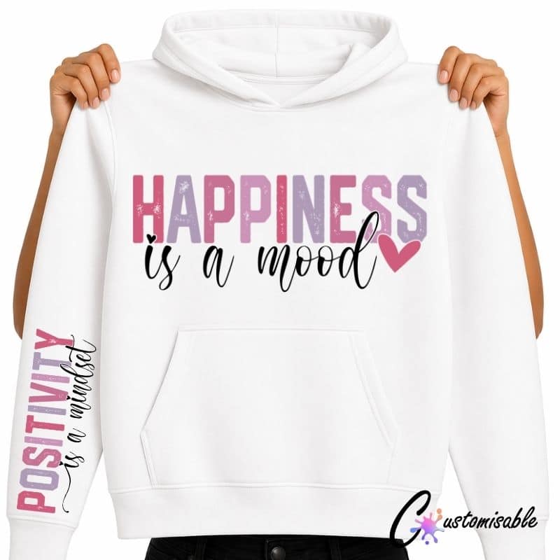 White hoodie with pink and purple “Happiness Is A Mood” DTF transfer design and matching “Positivity Is A Mindset” sleeve print.