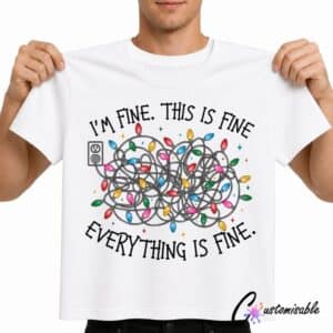 White T-shirt with “I’m Fine This Is Fine Everything Is Fine” DTF transfer design featuring tangled Christmas lights and colourful bulbs.