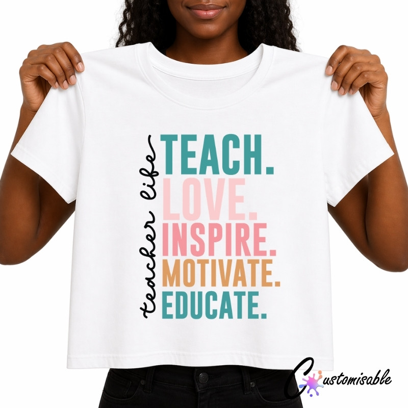 DTF Transfer Teacher Life A mockup of a white t-shirt featuring a colorful typography design for custom apparel. The text includes color lettering and is being held up by a person, showing a clear view of the custom apparel print.